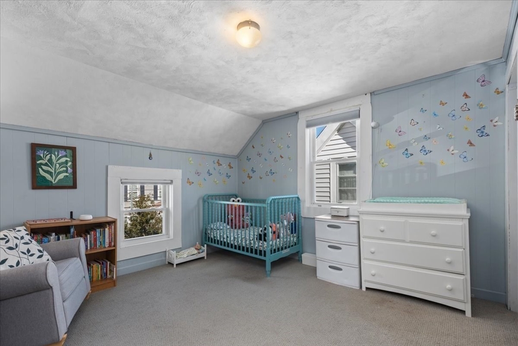 9 John Street Waltham, MA 02453 - Photo 33 of 43 a living room with furniture and a window