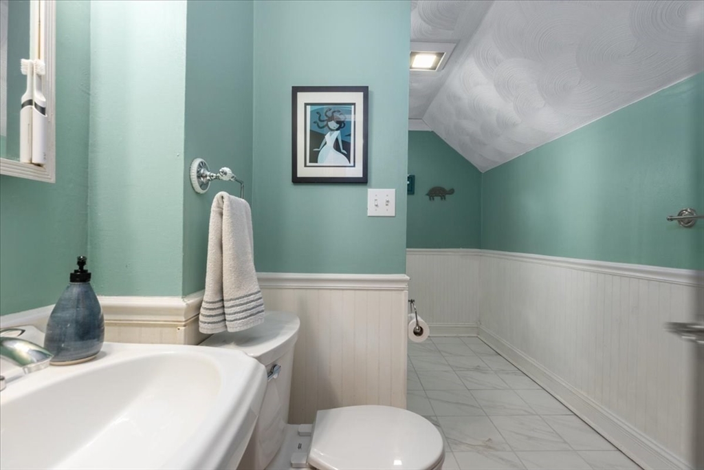 9 John Street Waltham, MA 02453 - Photo 36 of 43 a bathroom with a sink and a toilet