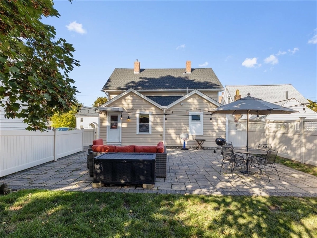 9 John Street Waltham, MA 02453 - Photo 40 of 43 a view of a house with a yard porch and sitting area
