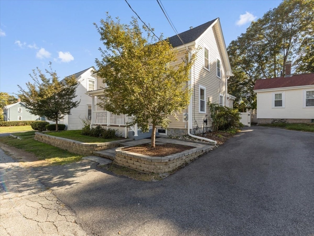 9 John Street Waltham, MA 02453 - Photo 4 of 43 a front view of a house with garden