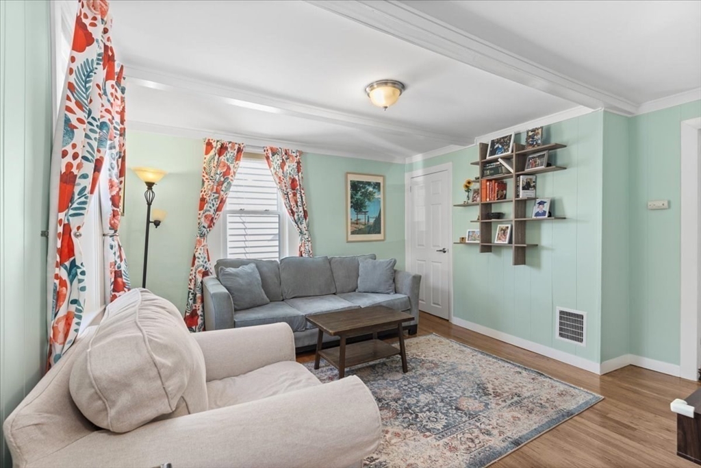 9 John Street Waltham, MA 02453 - Photo 8 of 43 a living room with furniture and a couch
