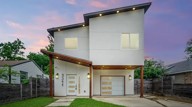 front view of a house with a yard