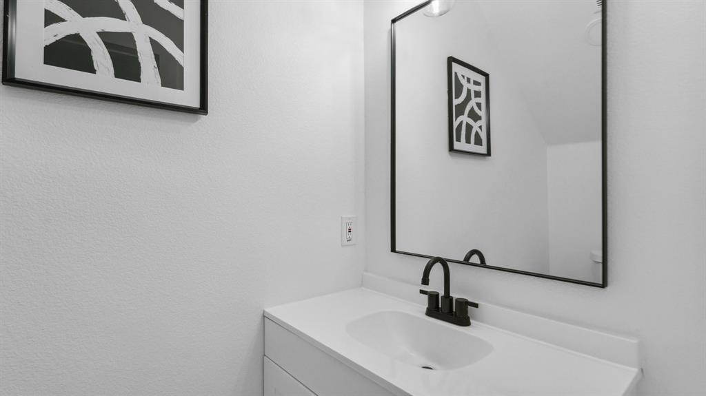 3311 Rutz Street Dallas, TX 75212 - Photo 11 of 21 a bathroom with a sink and mirror
