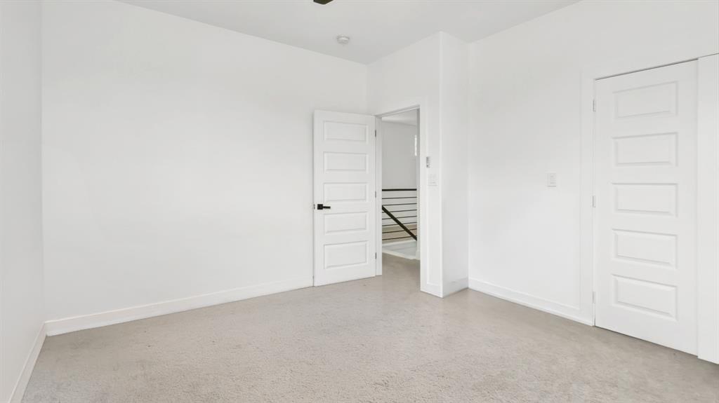 3311 Rutz Street Dallas, TX 75212 - Photo 14 of 21 an empty room with white cabinet and mirrors