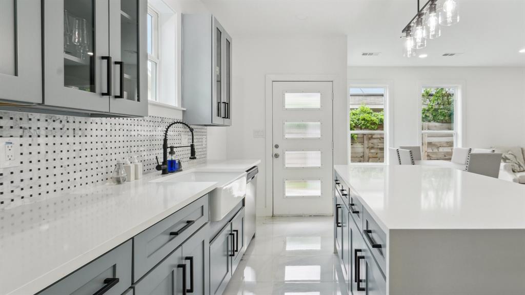 3311 Rutz Street Dallas, TX 75212 - Photo 6 of 21 a kitchen with a sink and a refrigerator