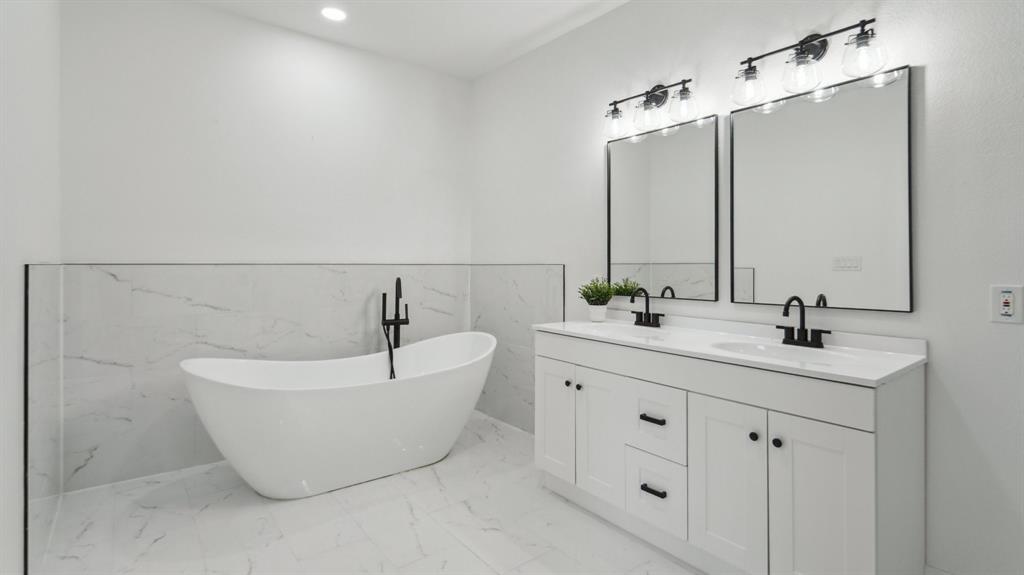 3311 Rutz Street Dallas, TX 75212 - Photo 9 of 21 a bathroom with a double vanity sink and mirror
