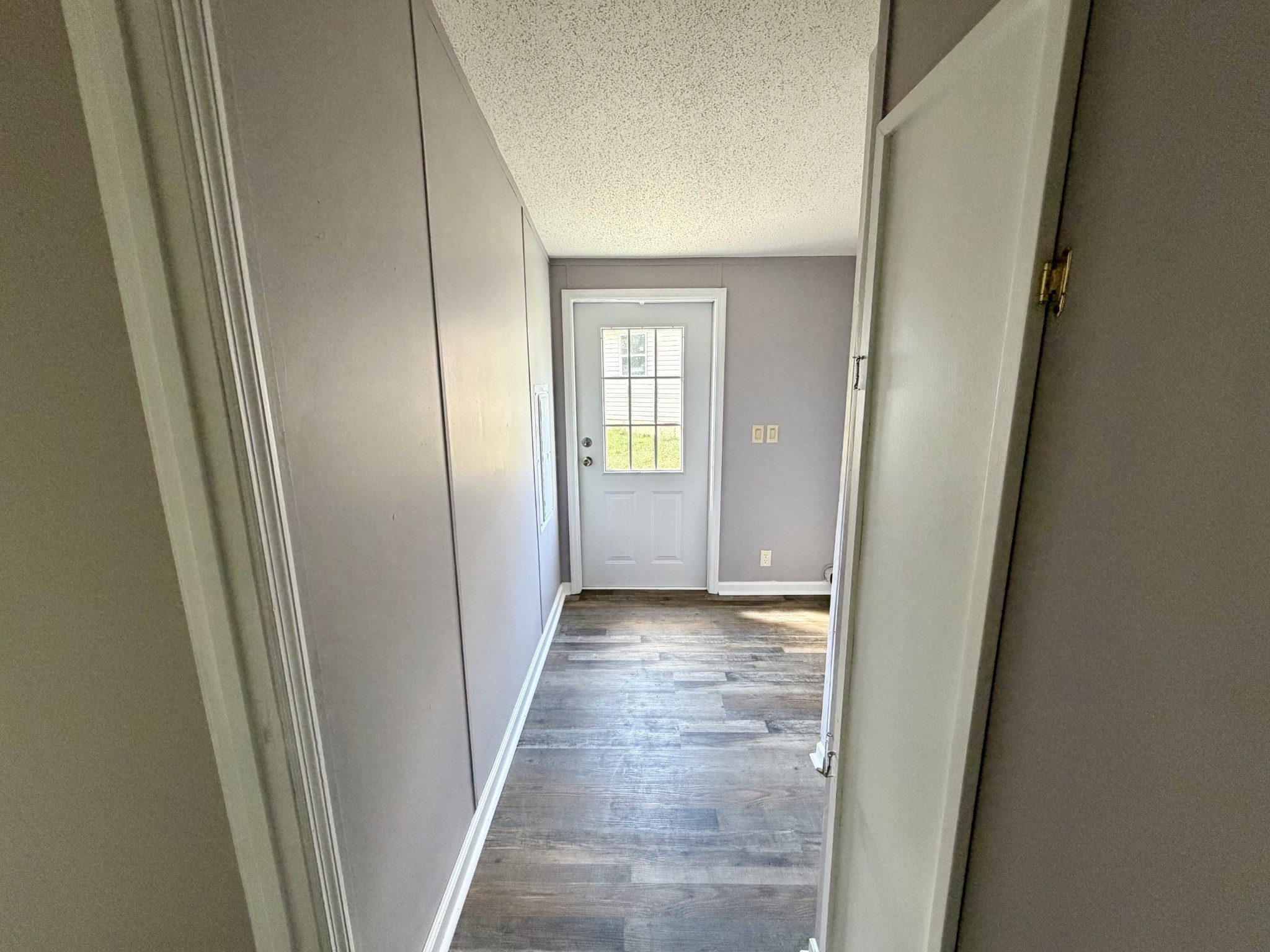 191 Buffalo Road Carthage, TN 37030 - Photo 18 of 42 a view of a hallway with wooden floor and closet