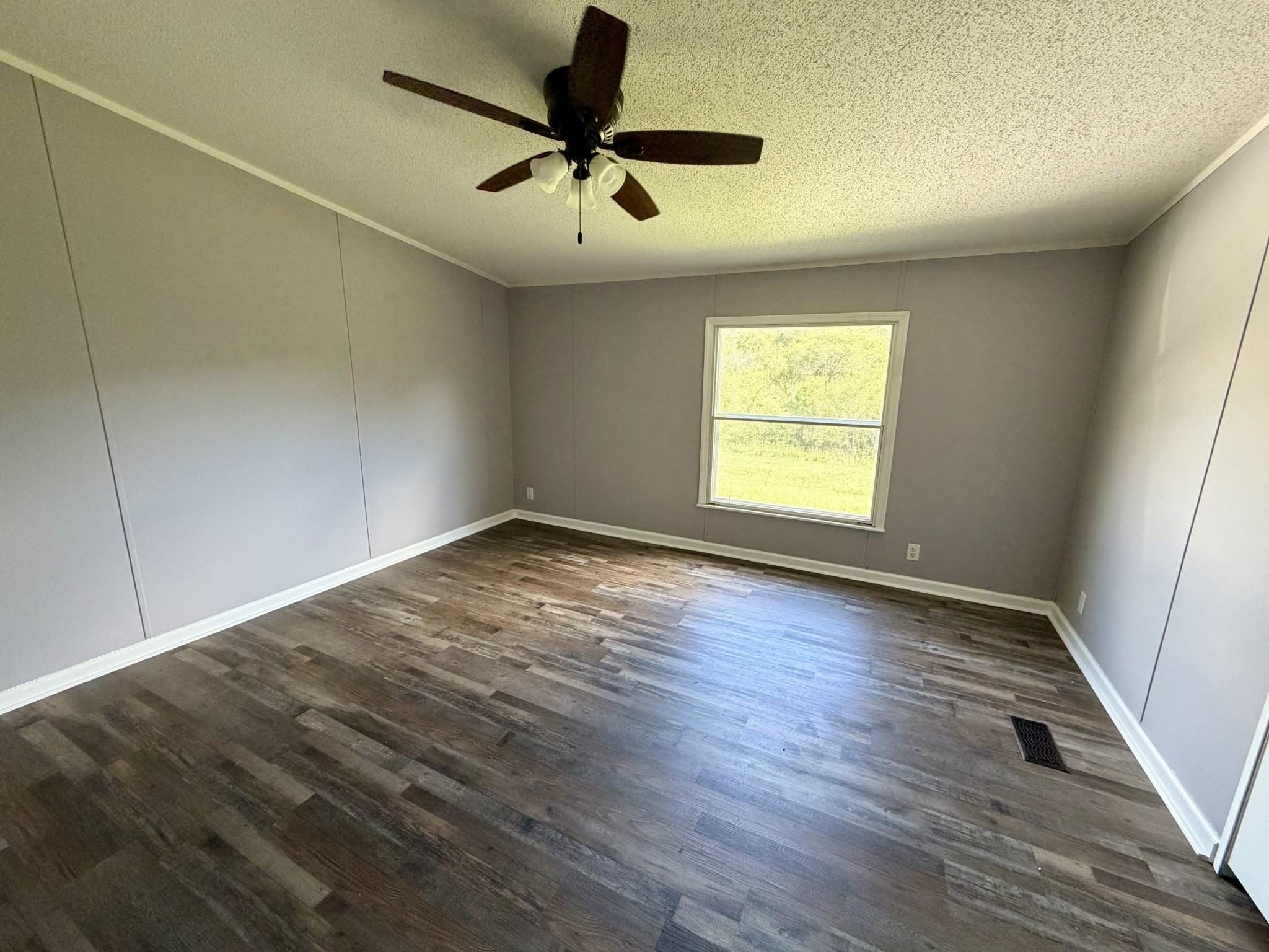 191 Buffalo Road Carthage, TN 37030 - Photo 30 of 42 wooden floor in an empty room with a window