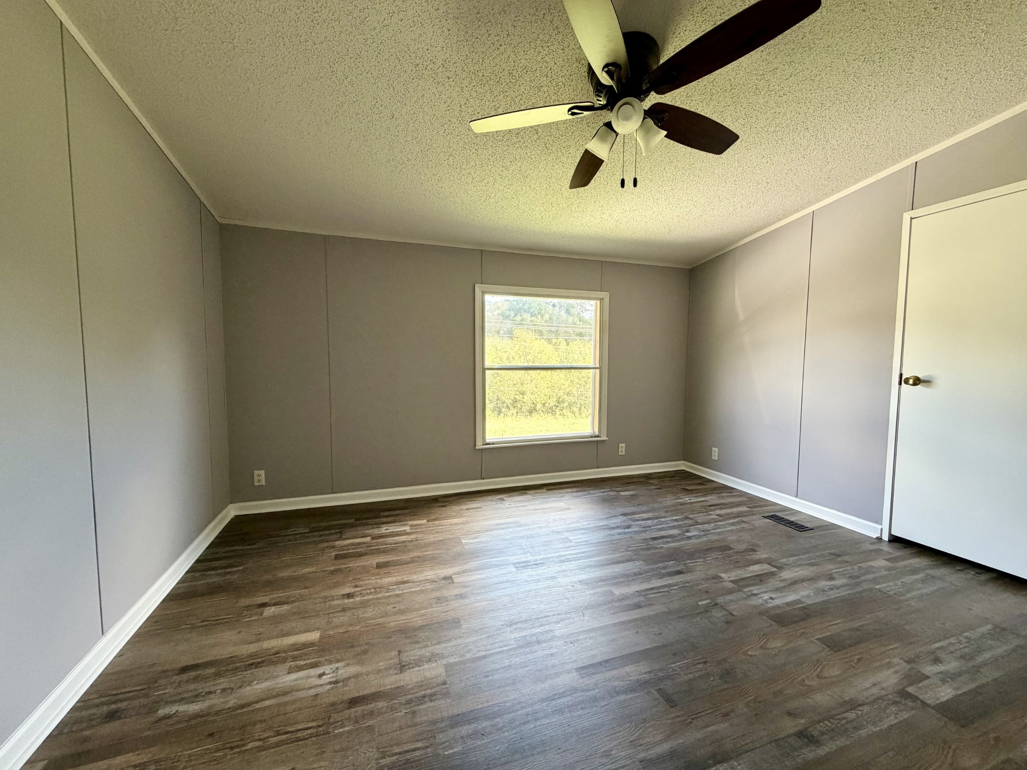 191 Buffalo Road Carthage, TN 37030 - Photo 32 of 42 wooden floor in an empty room with a window