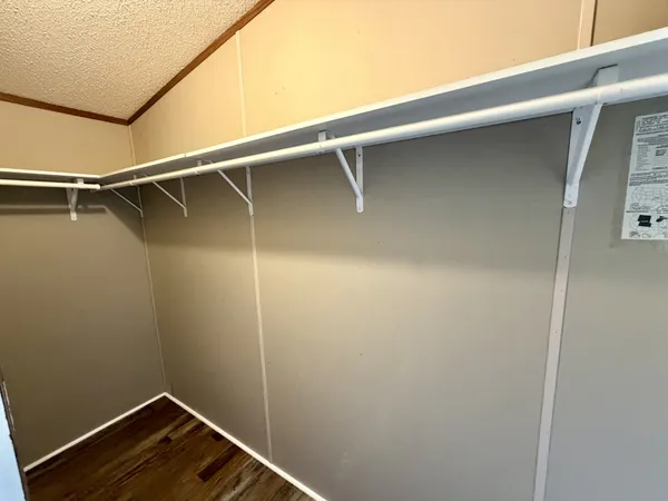 a bathroom with a sink and mirror with toilet