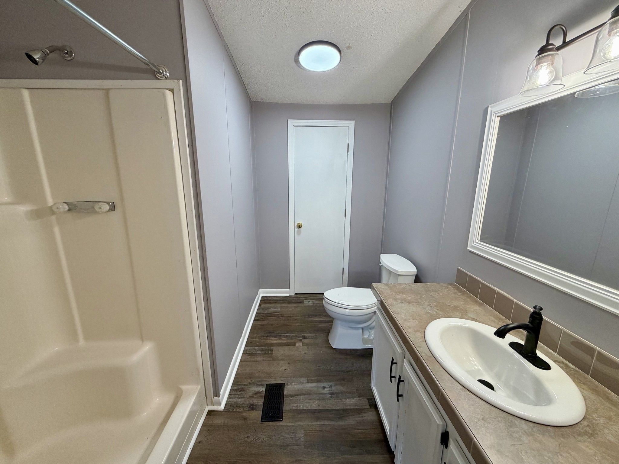 191 Buffalo Road Carthage, TN 37030 - Photo 34 of 42 a bathroom with a sink and mirror with toilet