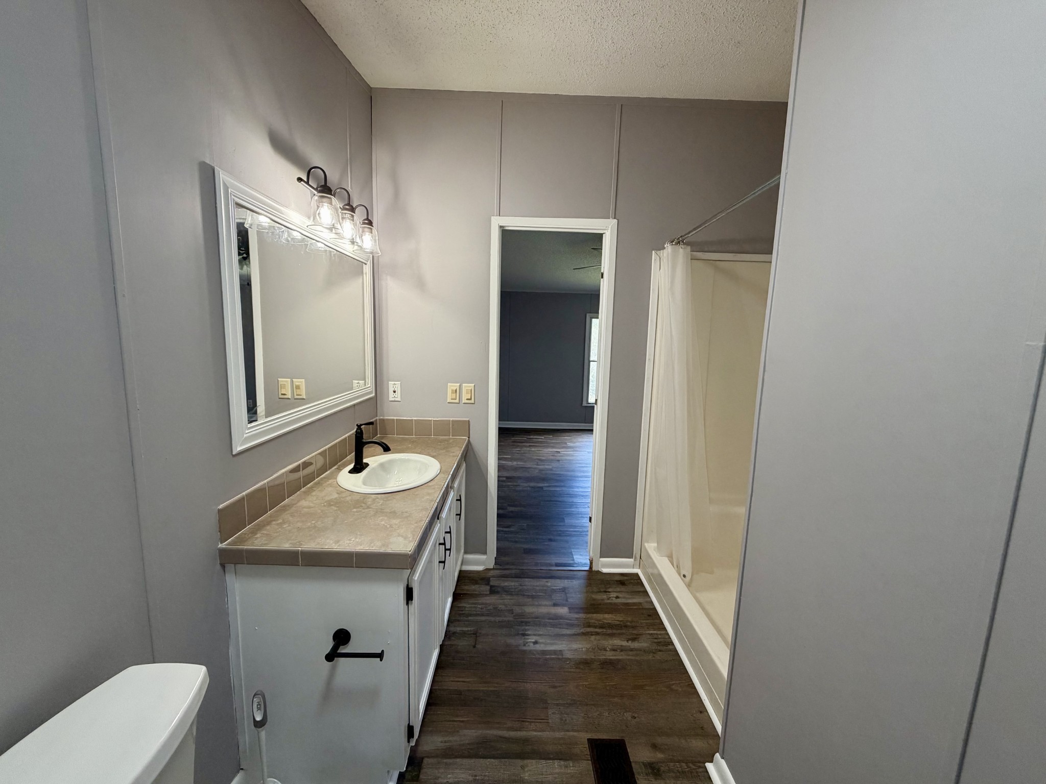 191 Buffalo Road Carthage, TN 37030 - Photo 36 of 42 a bathroom with a granite countertop sink and a mirror