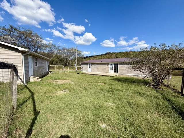 a view of a house with a big yard