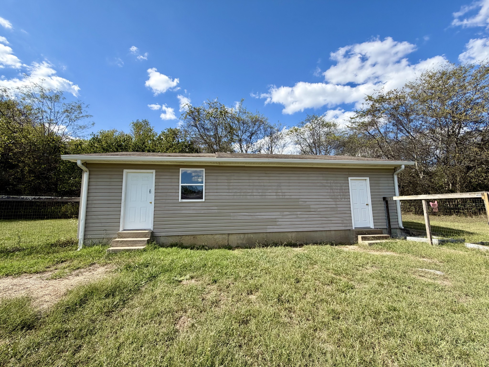 191 Buffalo Road Carthage, TN 37030 - Photo 41 of 42 front view of house with yard and trees in the background