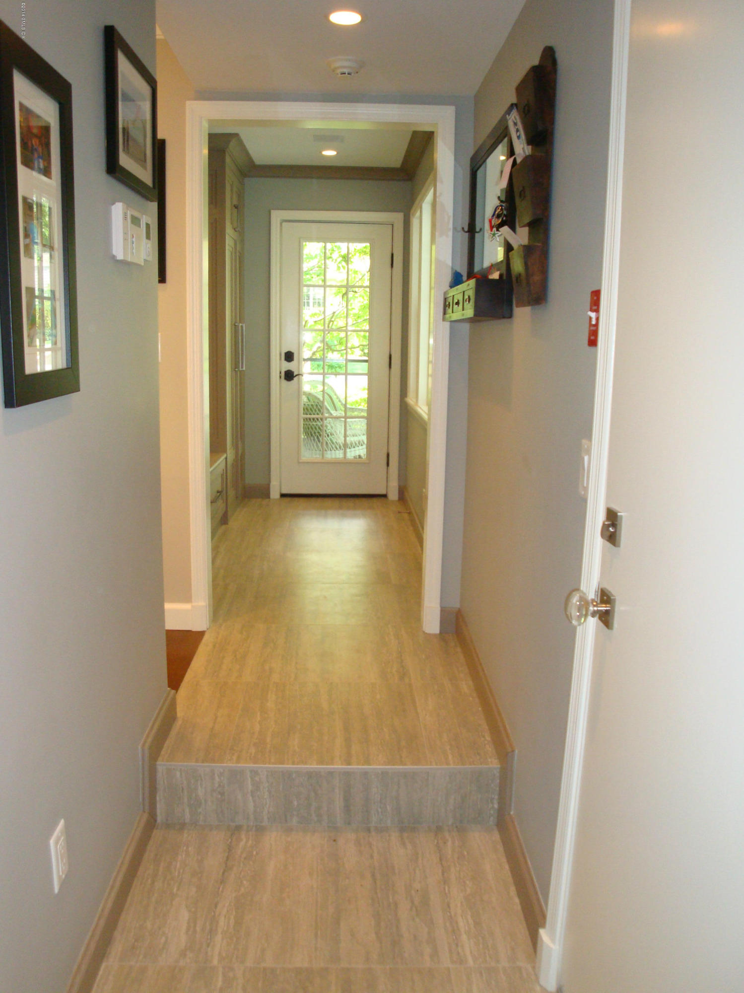 18 Hidden Brook Road Riverside, CT 06878 - Photo 11 of 32 a view of a hallway with wooden floor and a living room