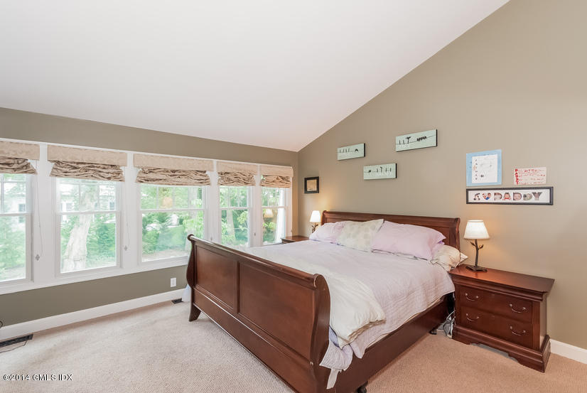 18 Hidden Brook Road Riverside, CT 06878 - Photo 12 of 32 a bedroom with a bed and a window
