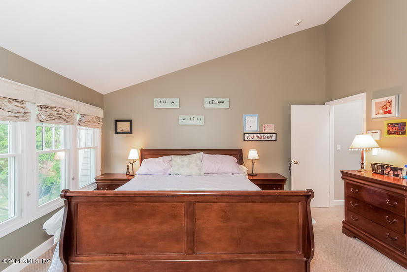 18 Hidden Brook Road Riverside, CT 06878 - Photo 13 of 32 a bedroom with a bed and a window
