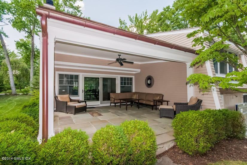 18 Hidden Brook Road Riverside, CT 06878 - Photo 26 of 32 a view of a house with backyard sitting area and garden
