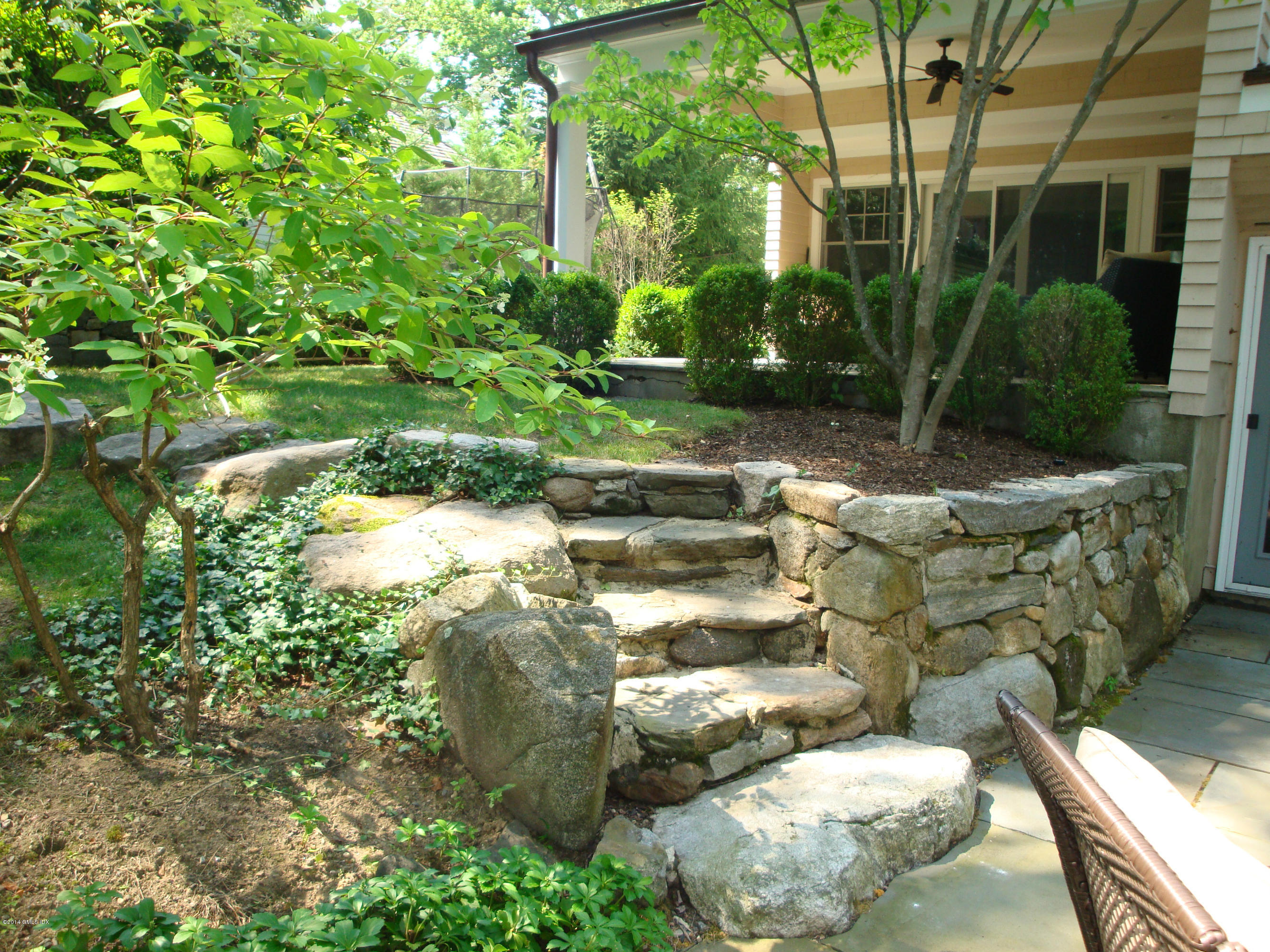 18 Hidden Brook Road Riverside, CT 06878 - Photo 27 of 32 a view of a backyard of the house