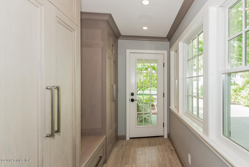 18 Hidden Brook Road Riverside, CT 06878 - Photo 10 of 32 a view of hallway with a large window and wooden floor