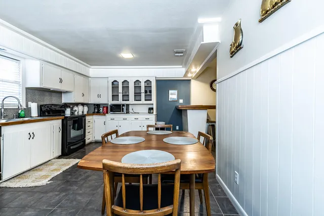 a kitchen with stainless steel appliances granite countertop a sink and cabinets