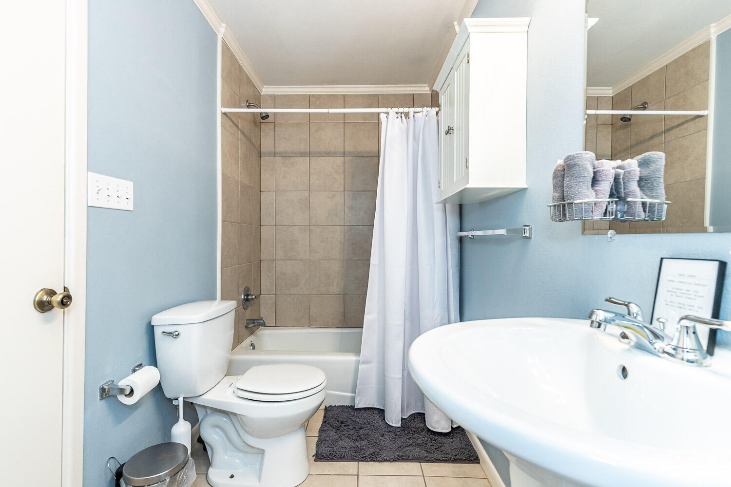 3504 38th Street Lubbock, TX 79413 - Photo 18 of 28 a bathroom with a sink a toilet and shower