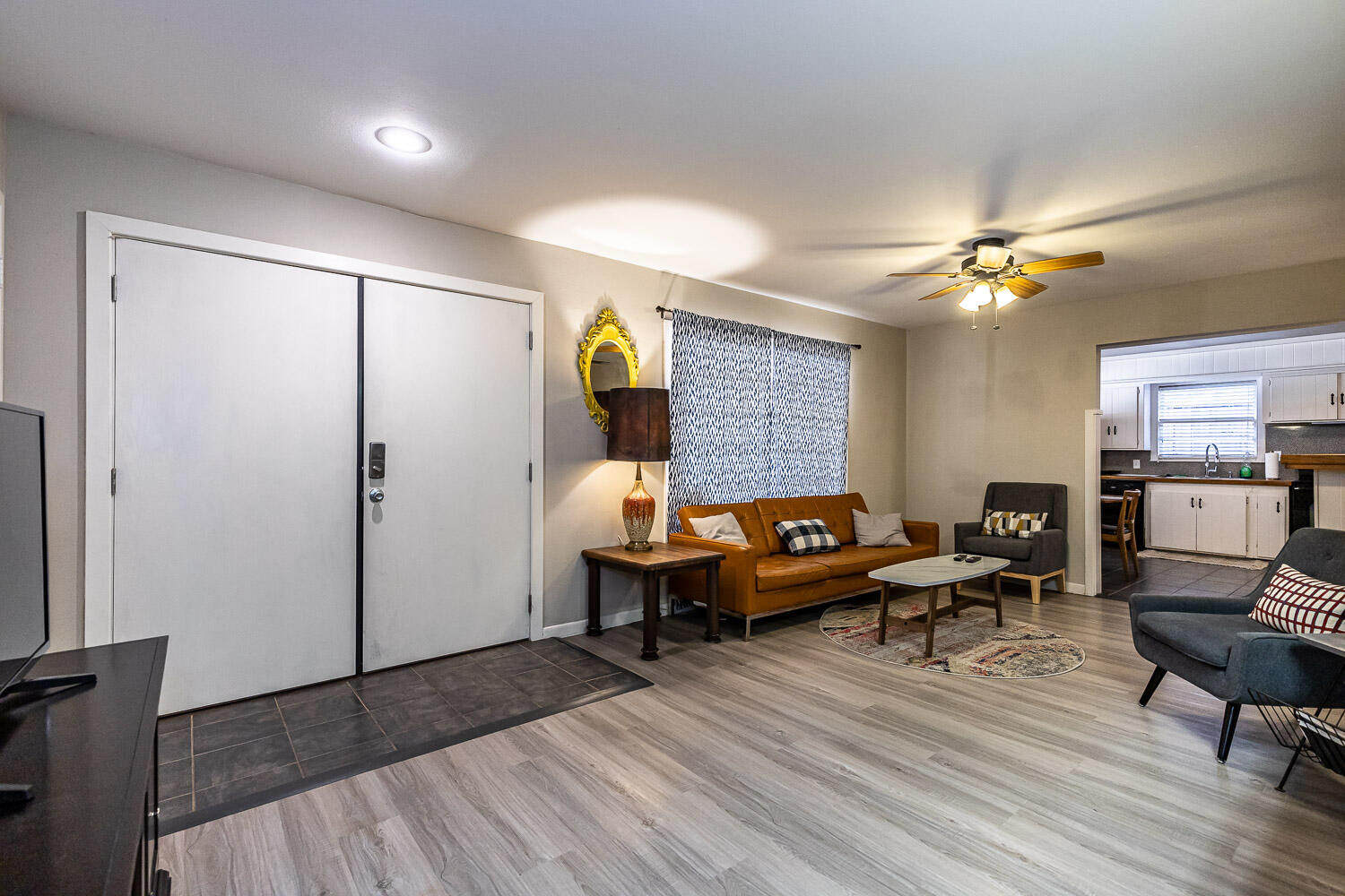3504 38th Street Lubbock, TX 79413 - Photo 6 of 28 a living room with furniture and a chandelier