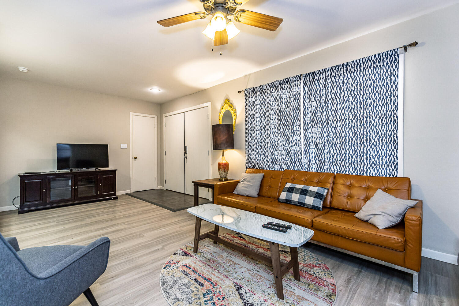 3504 38th Street Lubbock, TX 79413 - Photo 8 of 28 a living room with furniture and a flat screen tv