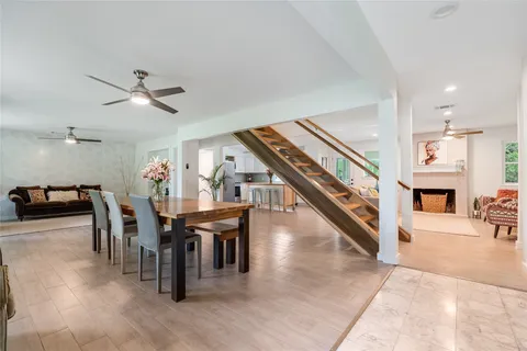 a dining room with furniture and window