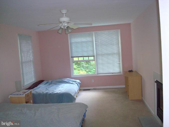 7538 Ridge Road Frederick, MD 21702 - Photo 11 of 15 a living room with furniture and a chandelier