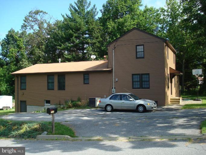 7538 Ridge Road Frederick, MD 21702 - Photo 3 of 15 a front view of a house with a yard