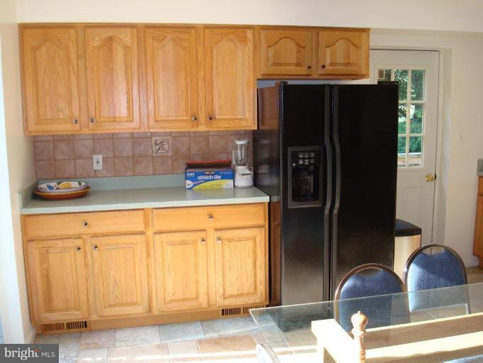 7538 Ridge Road Frederick, MD 21702 - Photo 6 of 15 a kitchen with stainless steel appliances a refrigerator and cabinets