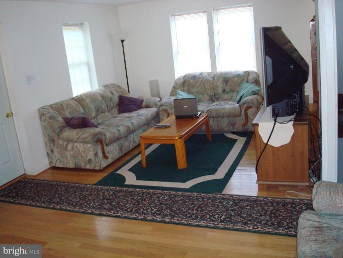 7538 Ridge Road Frederick, MD 21702 - Photo 8 of 15 a living room with furniture and a flat screen tv