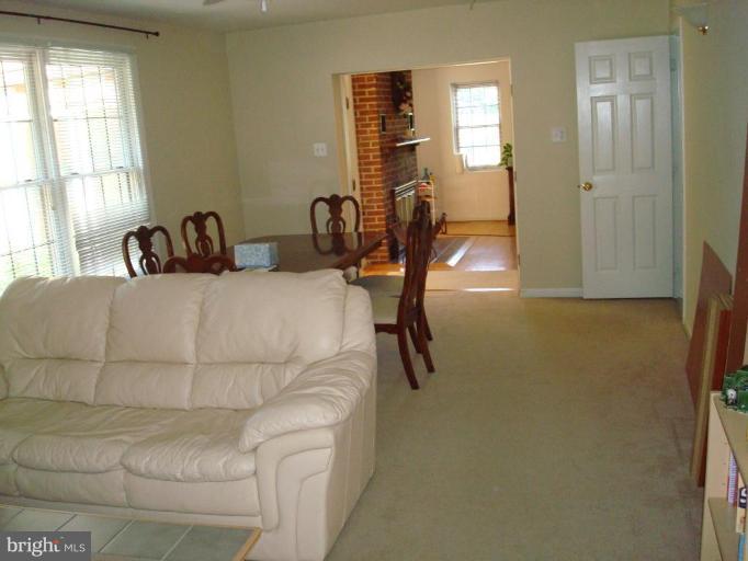 7538 Ridge Road Frederick, MD 21702 - Photo 9 of 15 a bedroom with a bed and furniture with window