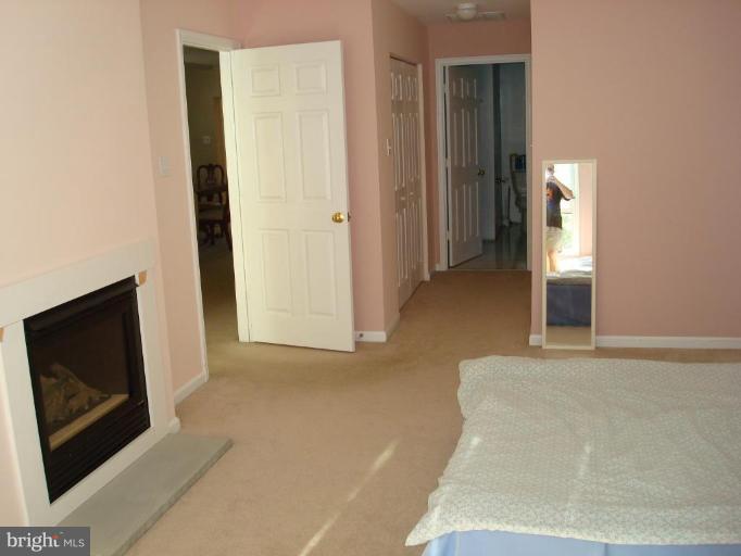 7538 Ridge Road Frederick, MD 21702 - Photo 10 of 15 a view of a livingroom with wooden floor and brick wall