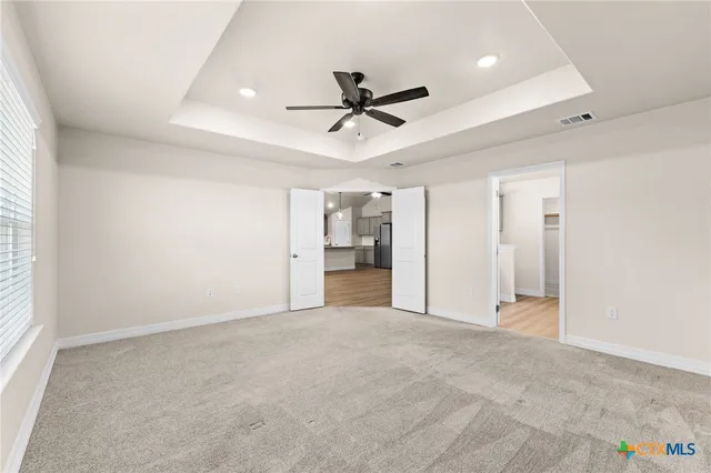 a view of an empty room with a window