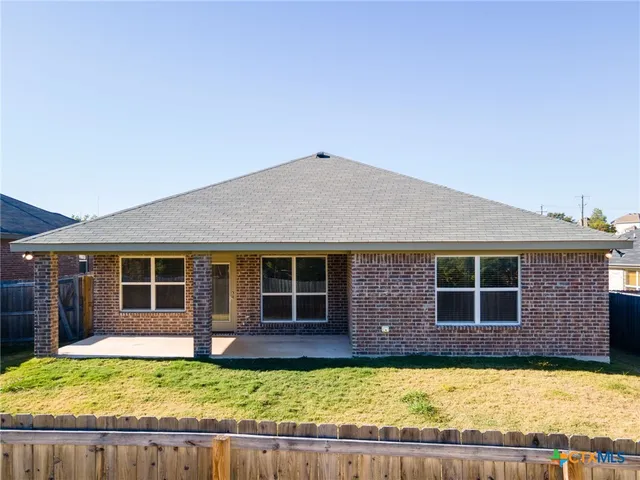 a view of a house with swimming pool in front of it