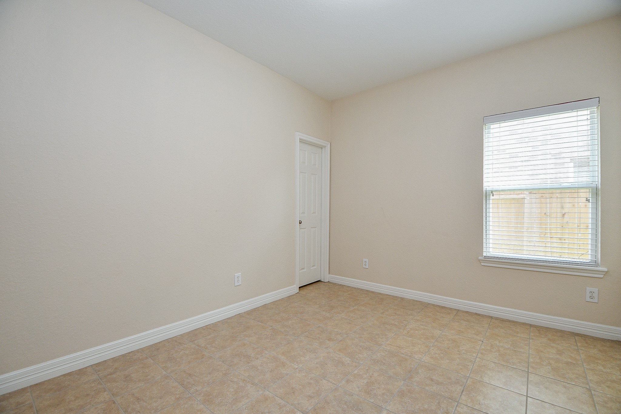 12104 Dawn Mist Court Pearland, TX 77584 - Photo 11 of 31 an empty room with a window