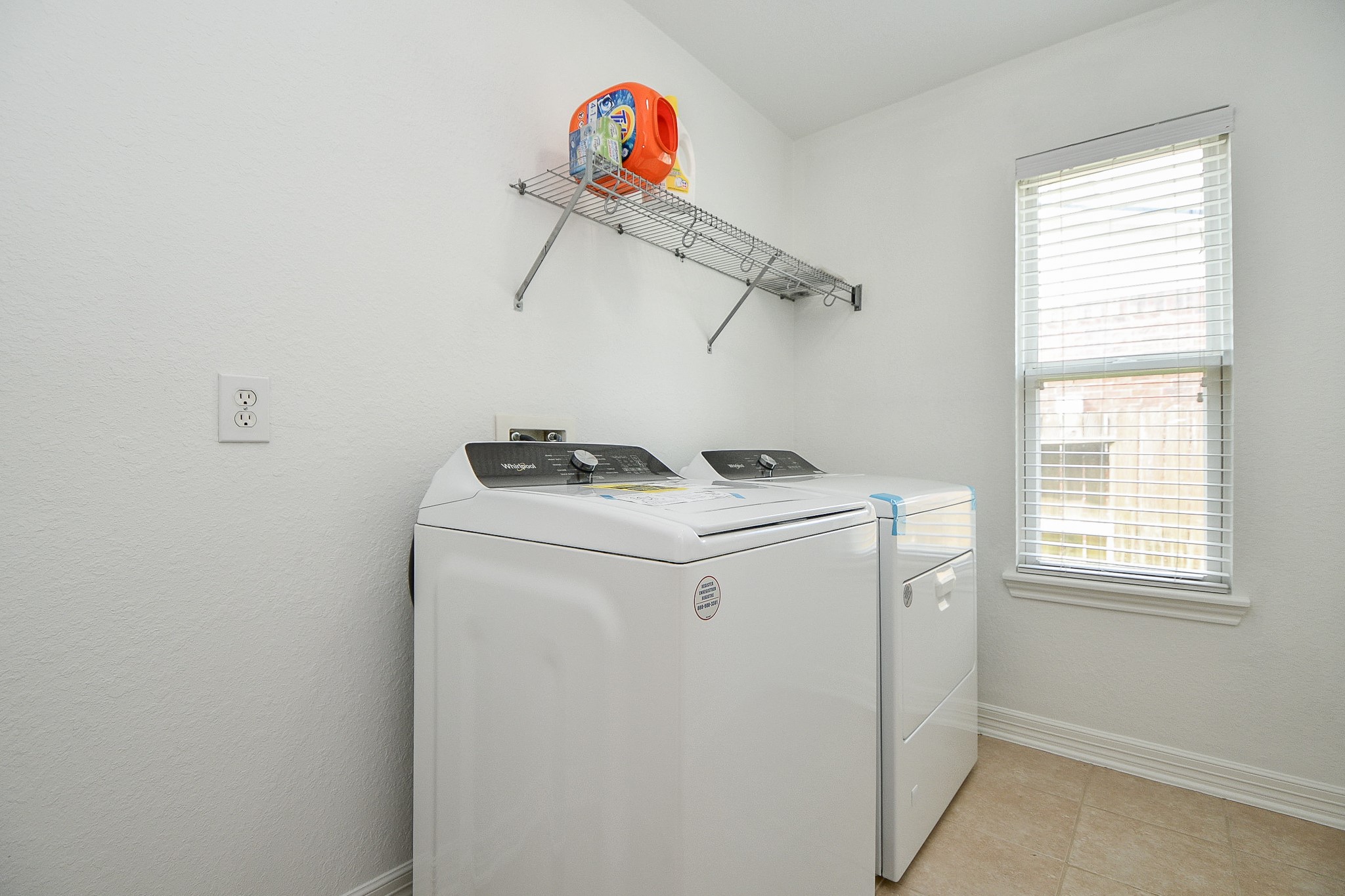 12104 Dawn Mist Court Pearland, TX 77584 - Photo 14 of 31 a utility room with dryer and washer