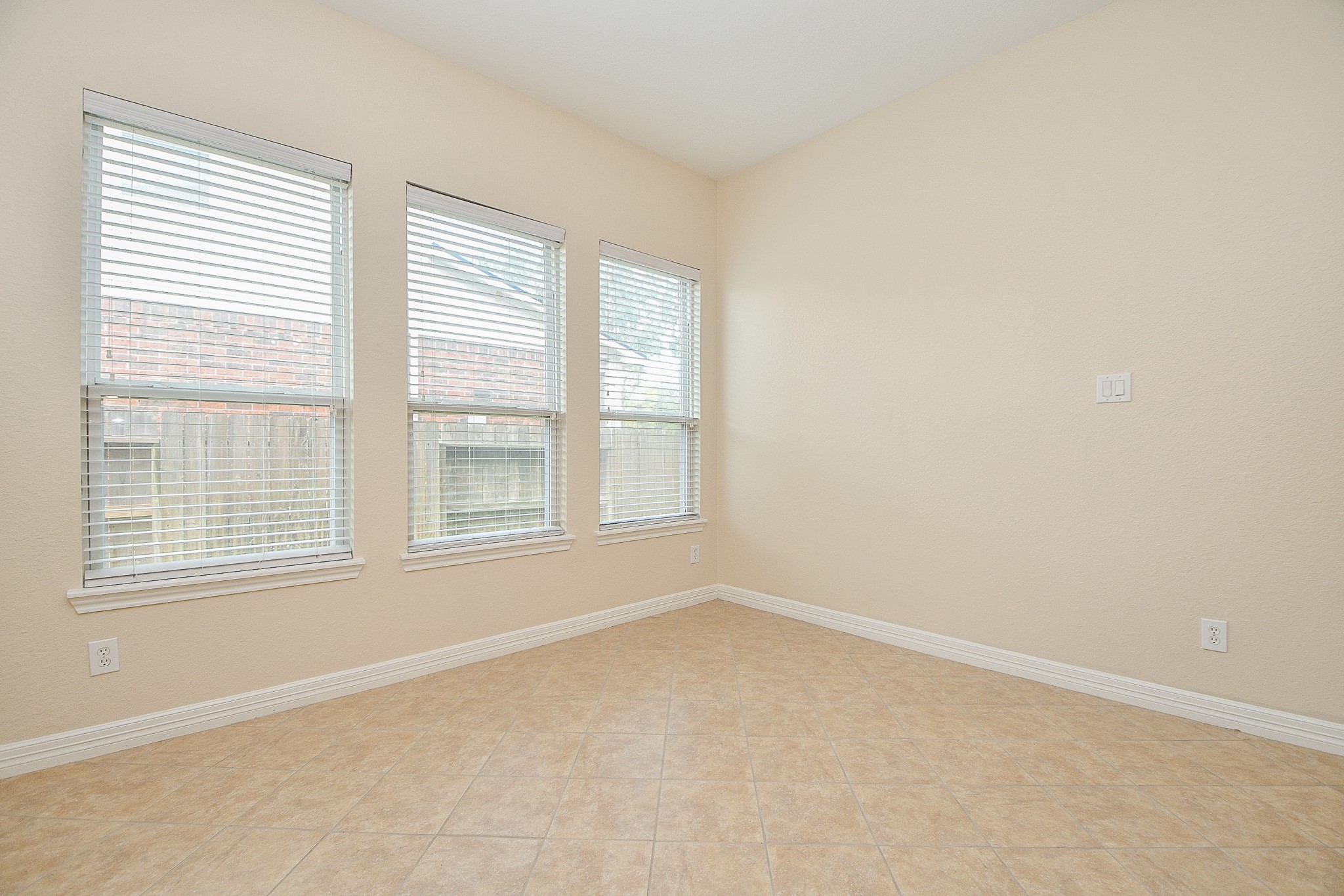 12104 Dawn Mist Court Pearland, TX 77584 - Photo 16 of 31 an empty room with a window
