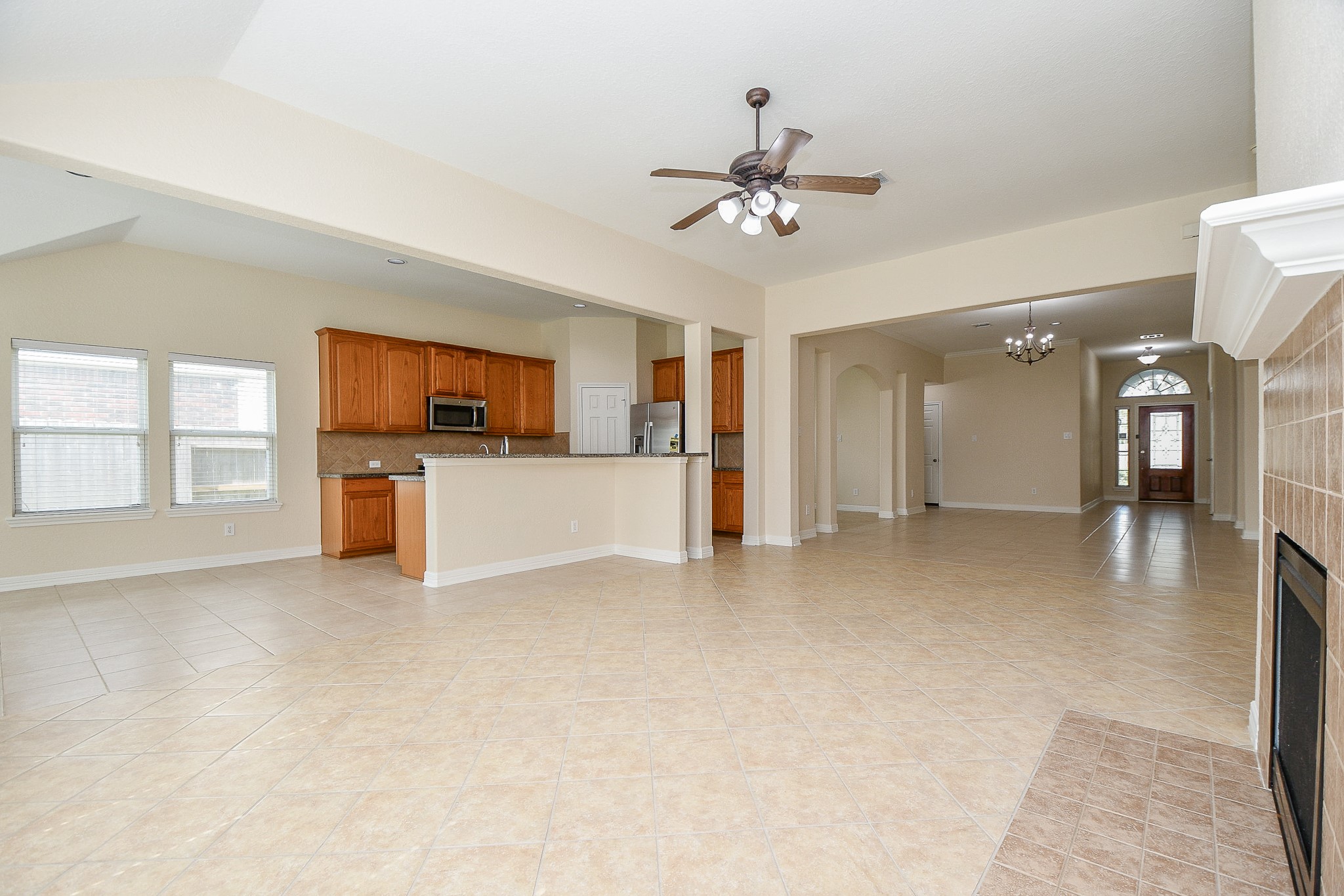 12104 Dawn Mist Court Pearland, TX 77584 - Photo 19 of 31 a view of a livingroom with a kitchen