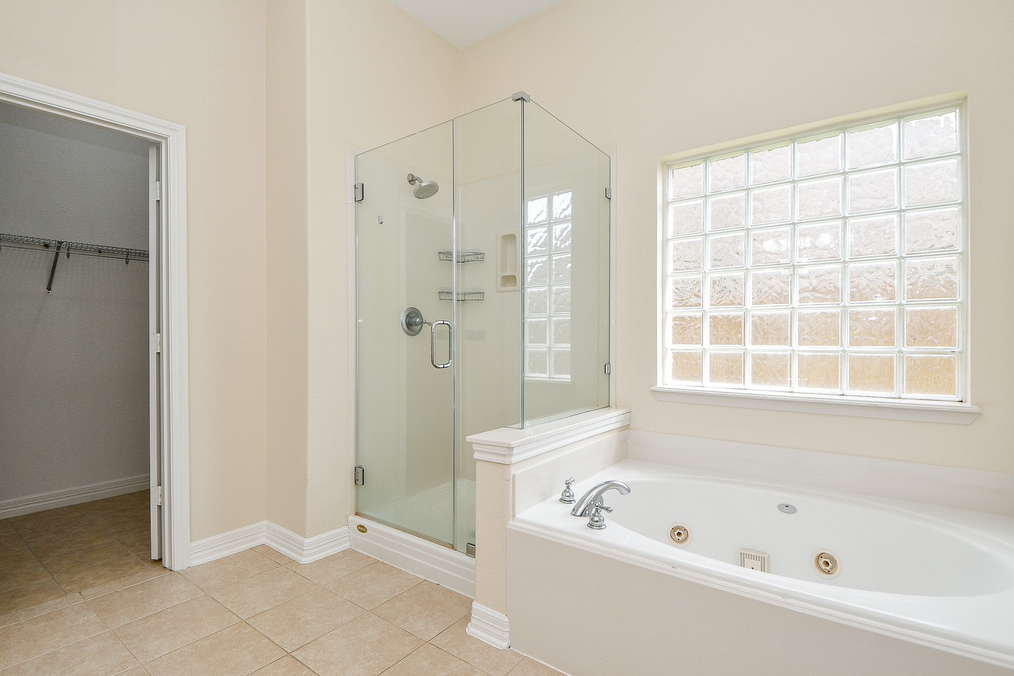 12104 Dawn Mist Court Pearland, TX 77584 - Photo 28 of 31 a bathroom with a bathtub and a shower