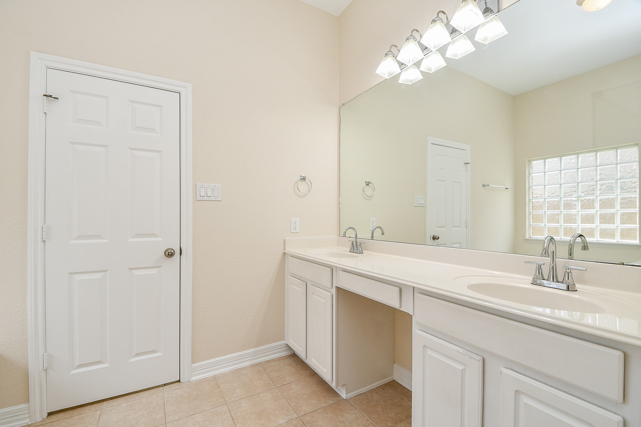 12104 Dawn Mist Court Pearland, TX 77584 - Photo 29 of 31 a bathroom with a sink a light fixture and a mirror