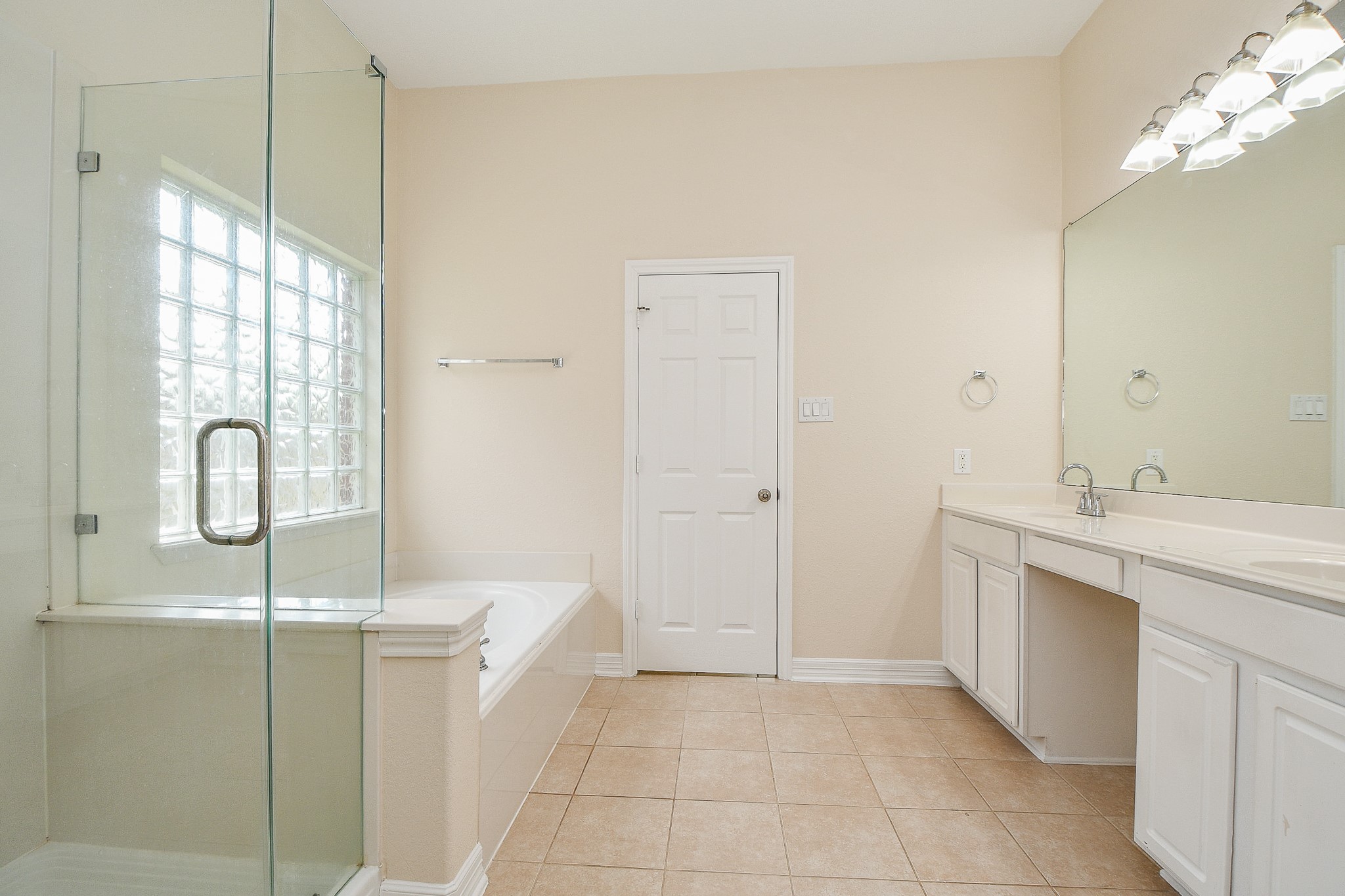 12104 Dawn Mist Court Pearland, TX 77584 - Photo 30 of 31 a bathroom with a double vanity sink a mirror and a shower