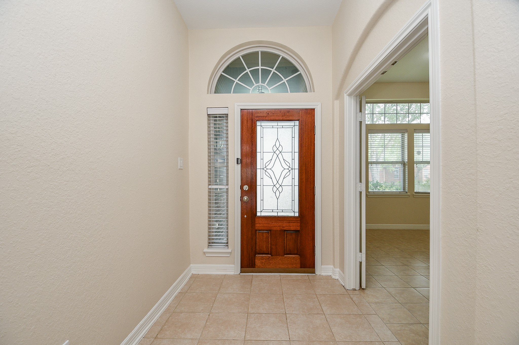 12104 Dawn Mist Court Pearland, TX 77584 - Photo 6 of 31 an entryway with a door