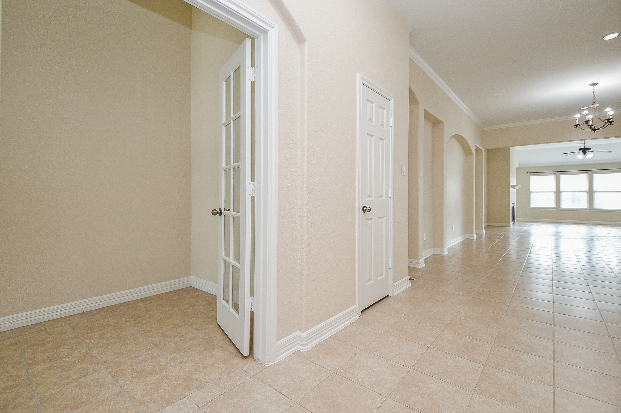 12104 Dawn Mist Court Pearland, TX 77584 - Photo 7 of 31 a view of a hallway with wooden floor