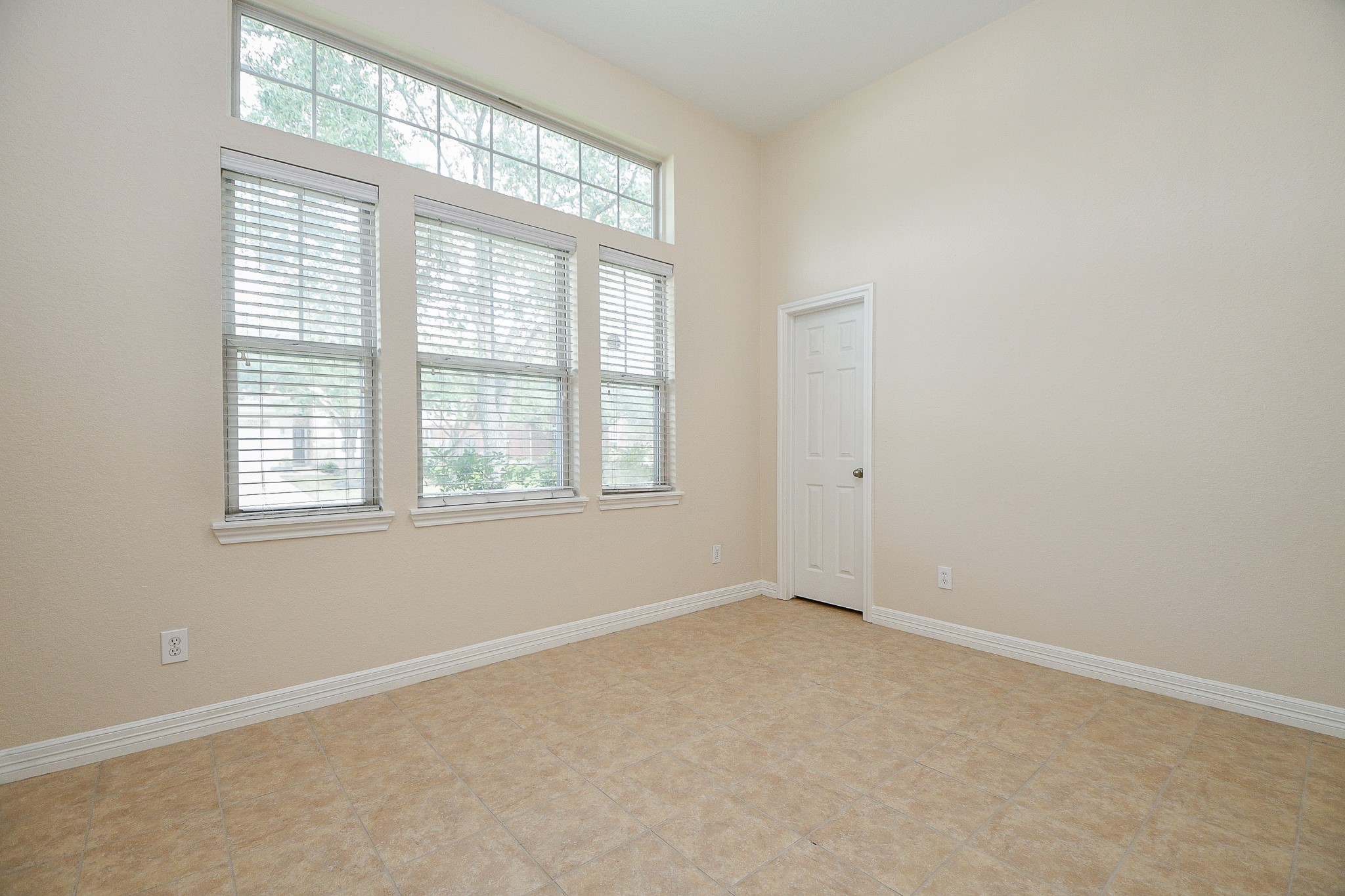 12104 Dawn Mist Court Pearland, TX 77584 - Photo 8 of 31 a view of an empty room with a window