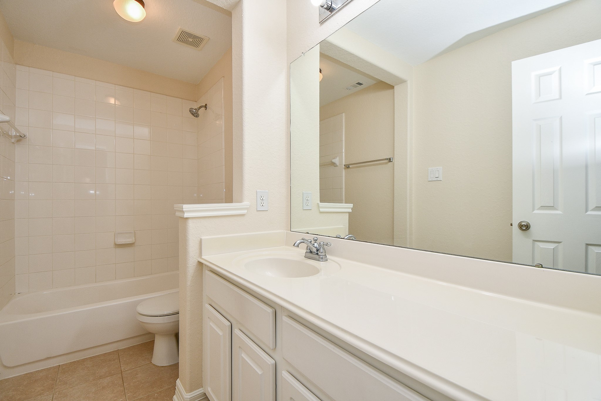 12104 Dawn Mist Court Pearland, TX 77584 - Photo 9 of 31 a bathroom with a bathtub shower sink vanity and toilet