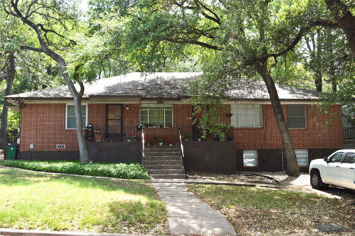 917 Keith Lane, Unit D Austin, TX 78705 - Photo 1 of 11 front view of a house with a yard