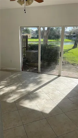 a view of a glass door with a floor to ceiling window